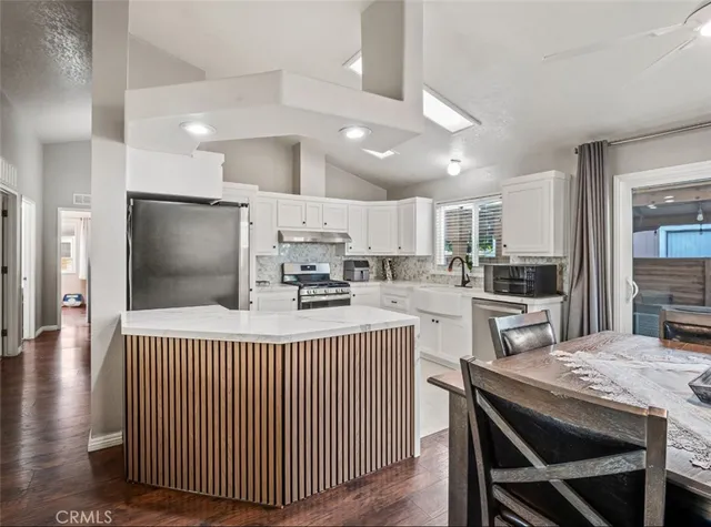 a kitchen with counter space cabinets and appliances