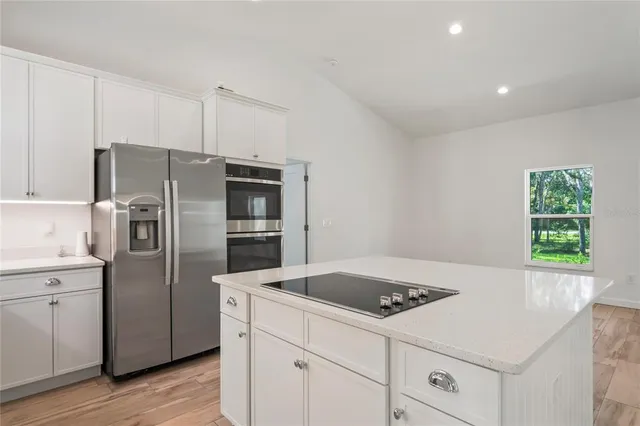 a view of a room with wooden floor and closet