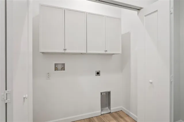 a view of an empty room and wooden floor