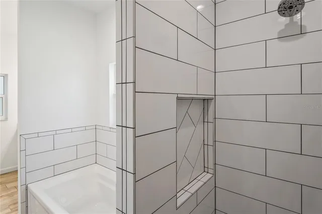 a bathroom with a double vanity sink and a mirror