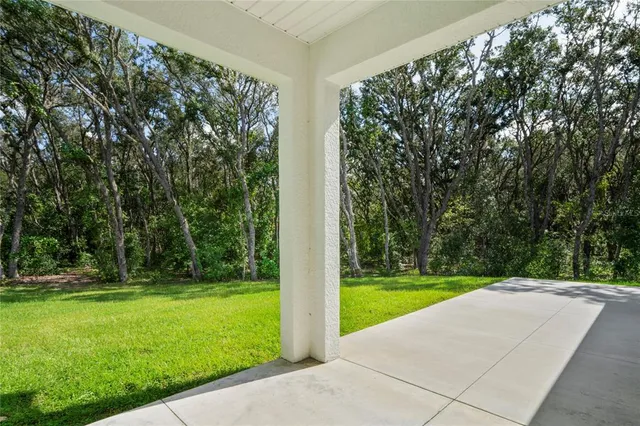 a house with a yard and a garage