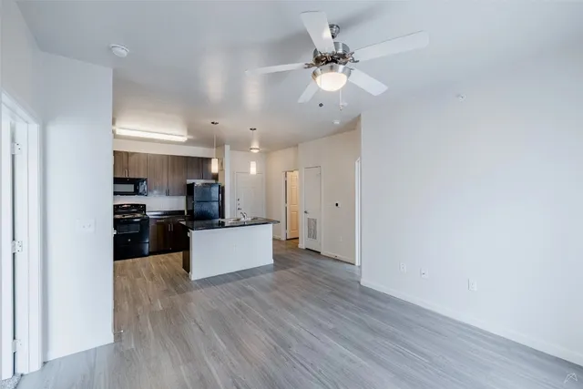 a view of kitchen with sink microwave and stove