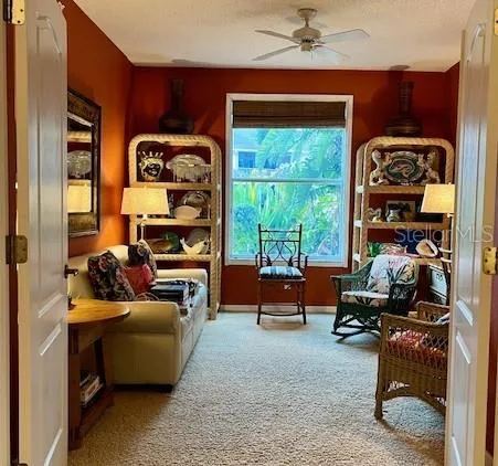 a bedroom with furniture and a window