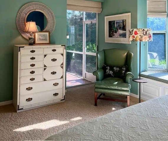 a bedroom with a bed and a couch