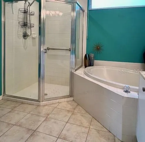 a bathroom with a toilet and a shower curtain
