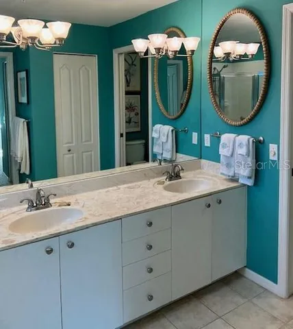 a bathroom with a sink and mirror
