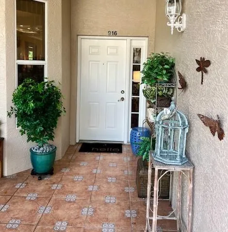 a kitchen with stainless steel appliances a stove a refrigerator and a table
