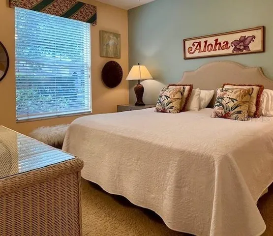 a kitchen with lots of wooden furniture and appliances