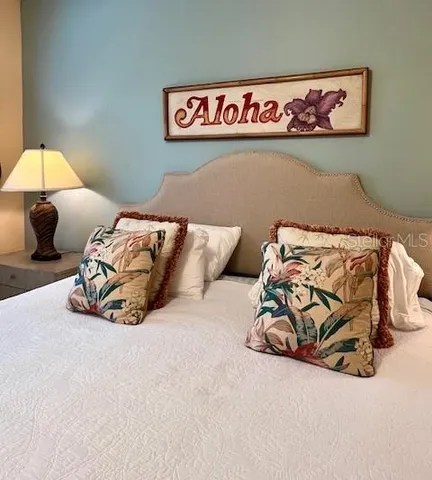 a dining room with wooden floor and a table