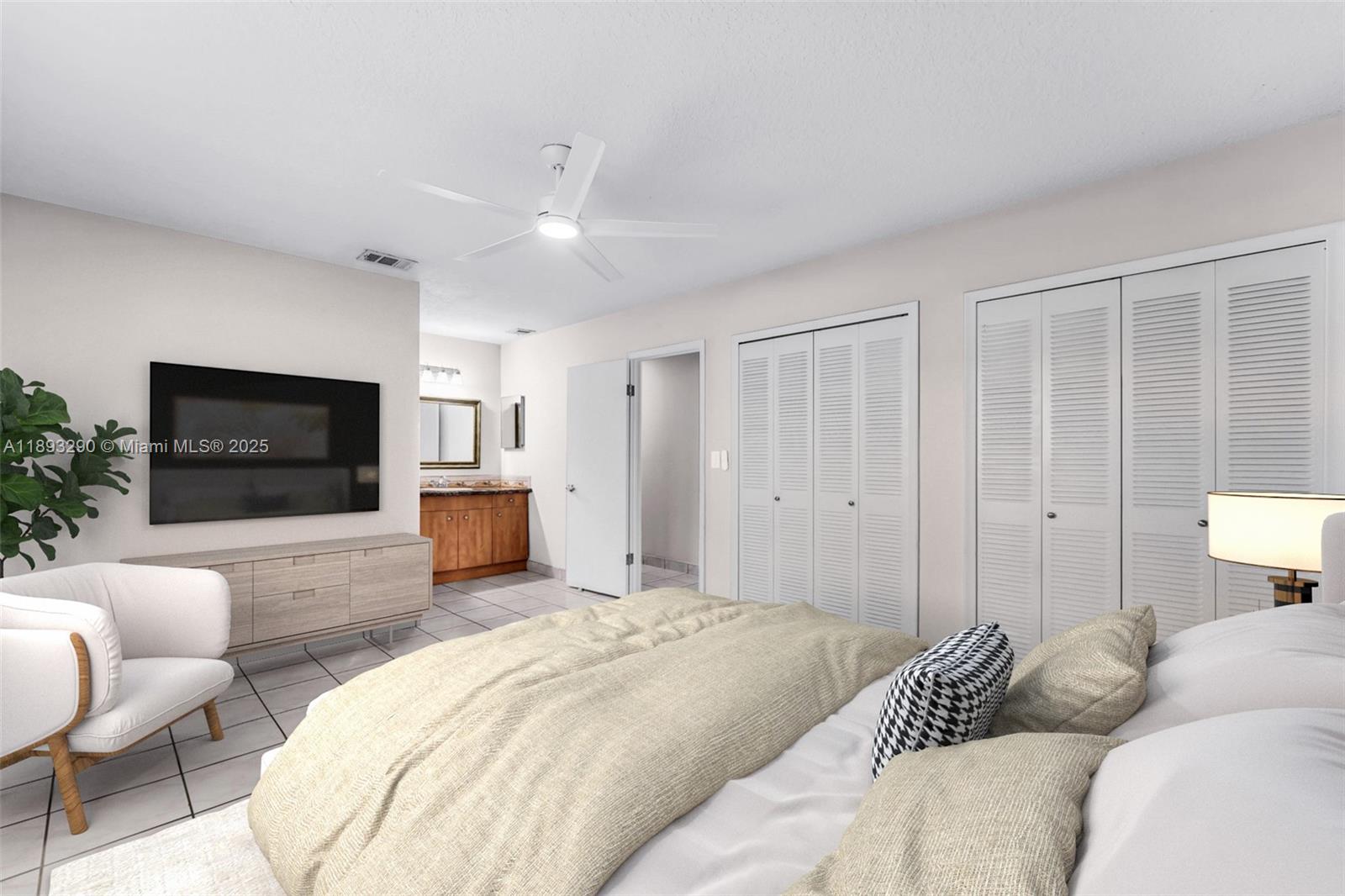 10121 Southwest 4th Street Miami, FL 33174 - Photo 1 of 31 a bedroom with a bed a couch and a flat screen tv