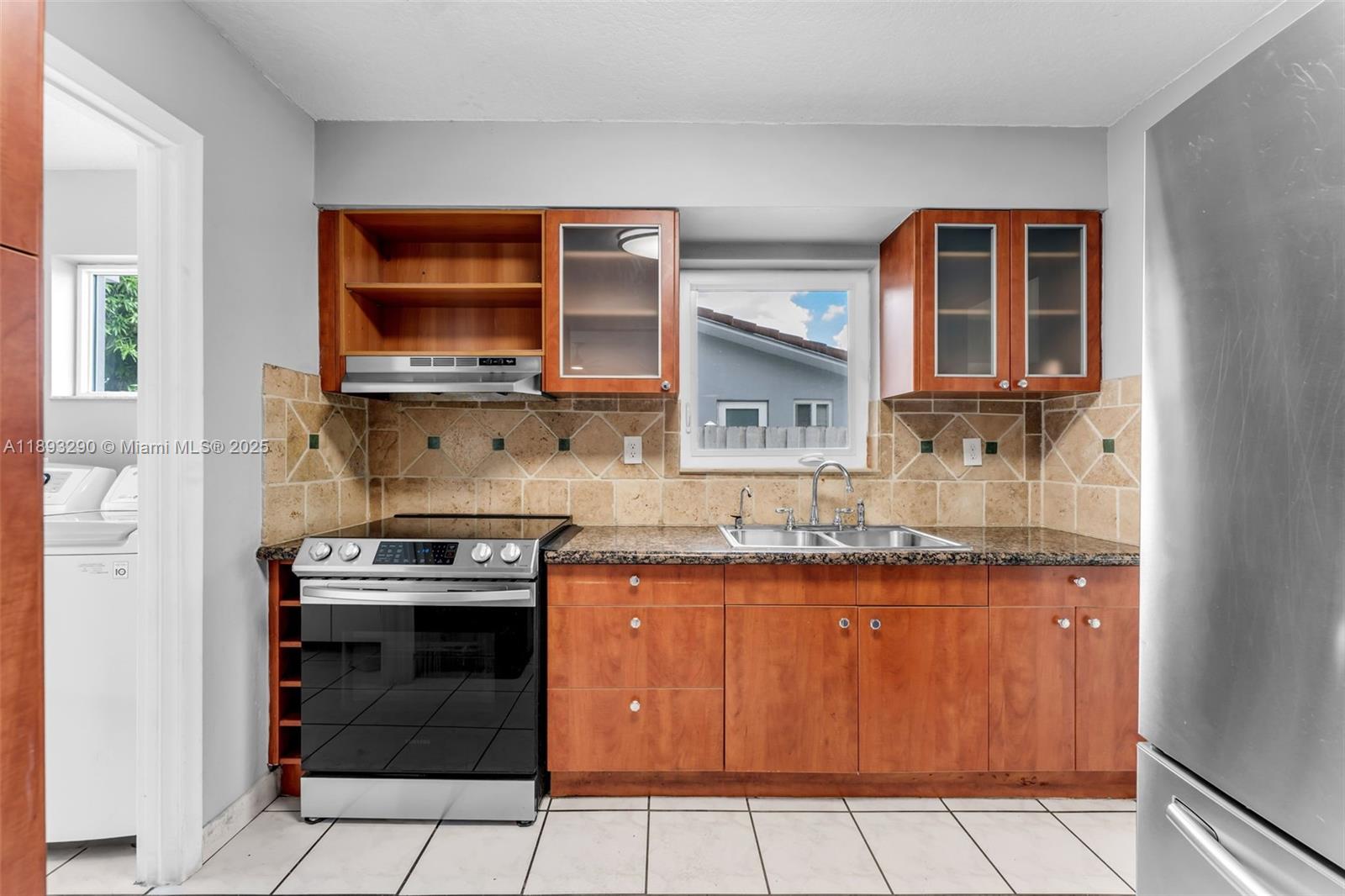 10121 Southwest 4th Street Miami, FL 33174 - Photo 12 of 31 a kitchen with stainless steel appliances granite countertop a stove and a microwave