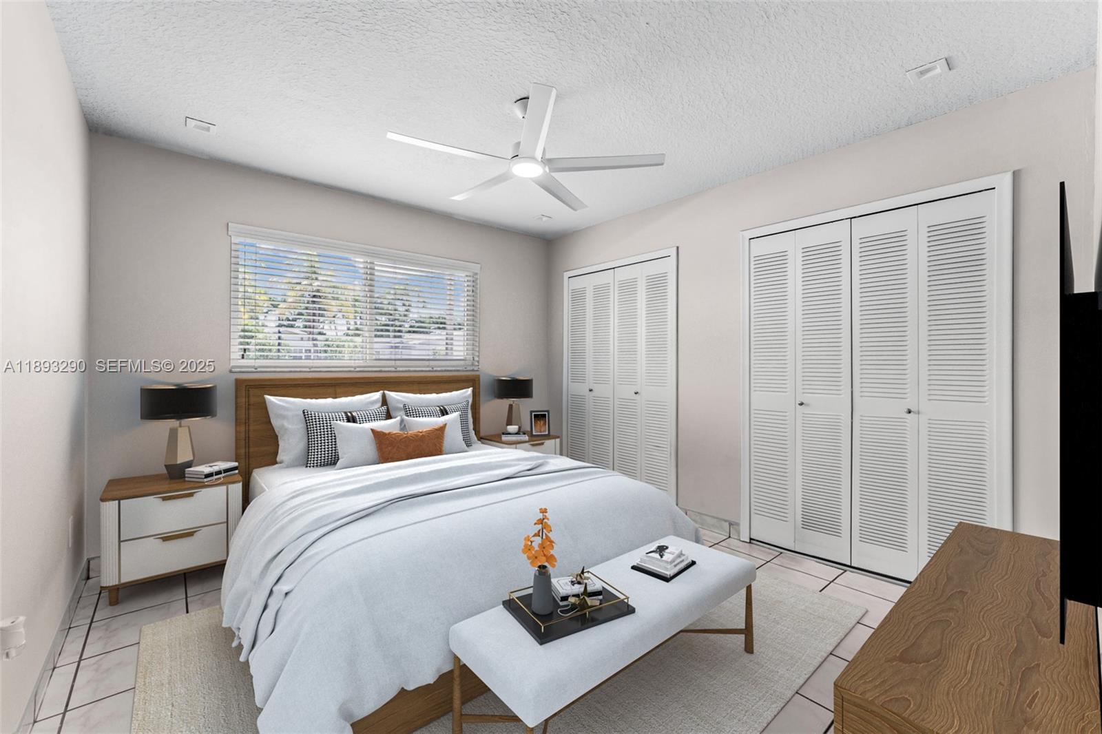 10121 Southwest 4th Street Miami, FL 33174 - Photo 13 of 31 a bedroom with a bed and wooden floor