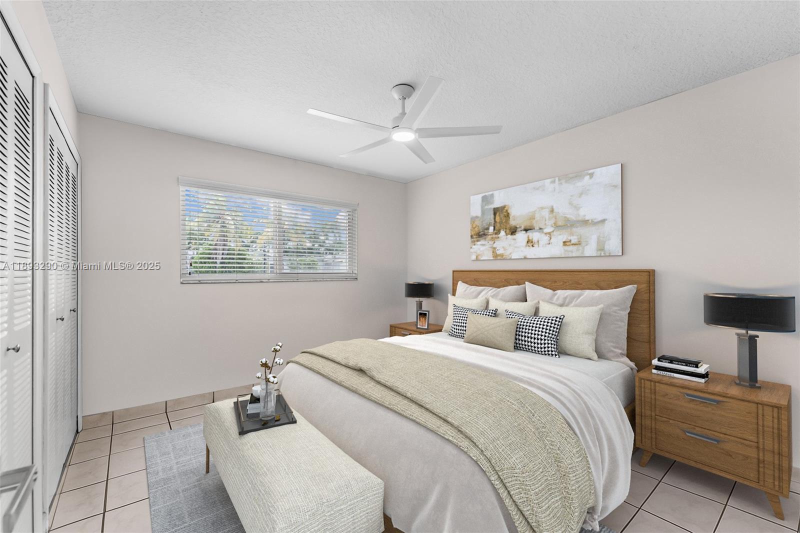 10121 Southwest 4th Street Miami, FL 33174 - Photo 15 of 31 a bedroom with a large bed and a chandelier