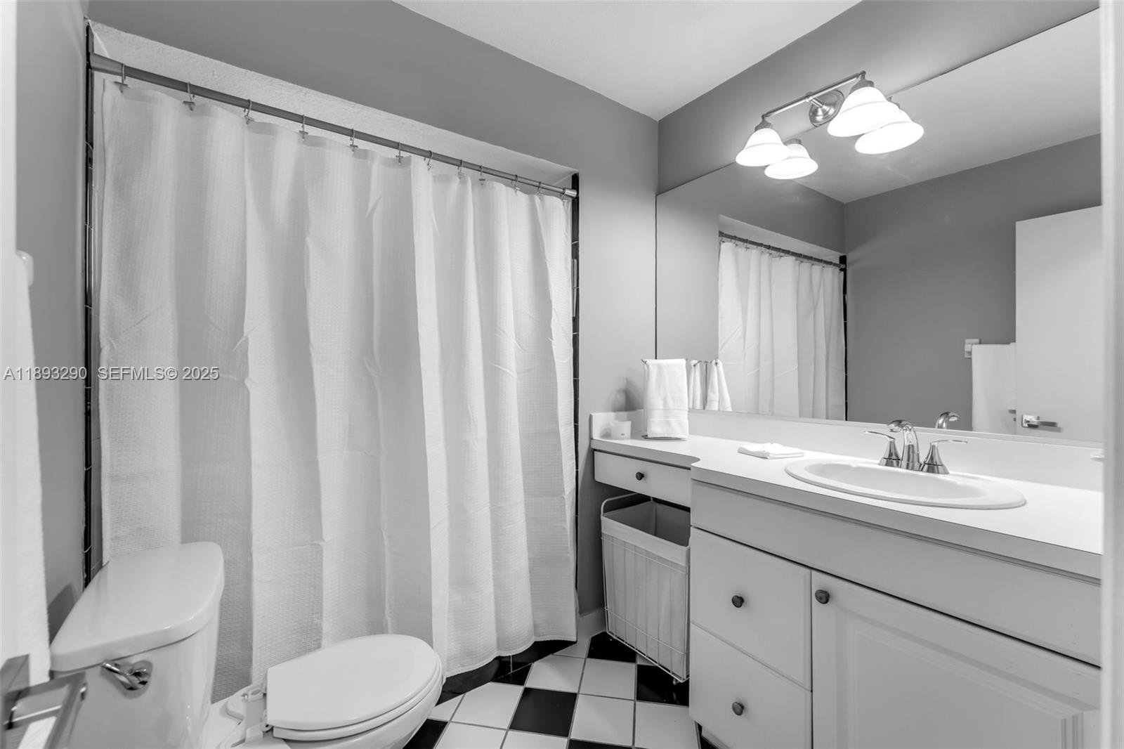 10121 Southwest 4th Street Miami, FL 33174 - Photo 15 of 31 a bathroom with a double vanity sink toilet and a mirror