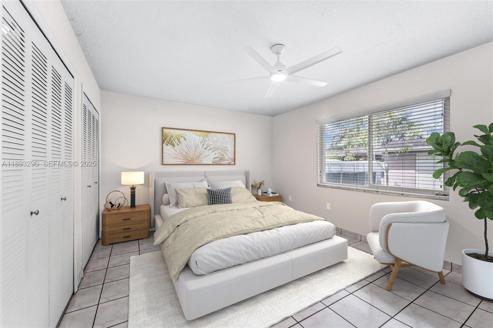 10121 Southwest 4th Street Miami, FL 33174 - Photo 18 of 31 a bedroom with a large bed and a chandelier