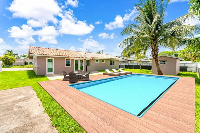 a view of a backyard with swimming pool