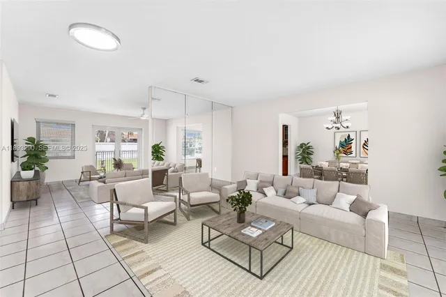 a living room with furniture and a rug