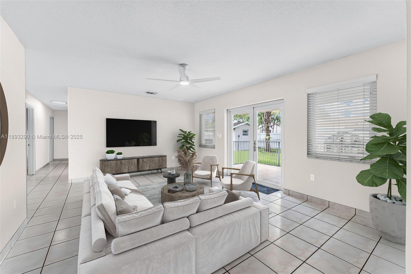 10121 Southwest 4th Street Miami, FL 33174 - Photo 8 of 31 a living room with furniture and a flat screen tv