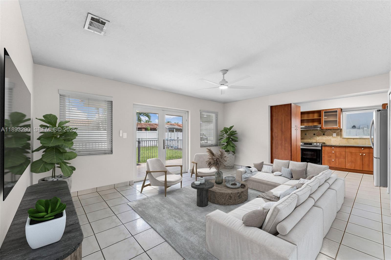 10121 Southwest 4th Street Miami, FL 33174 - Photo 8 of 31 a living room with furniture and a potted plant