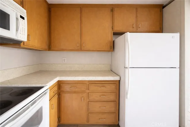 a view of an empty room and a window