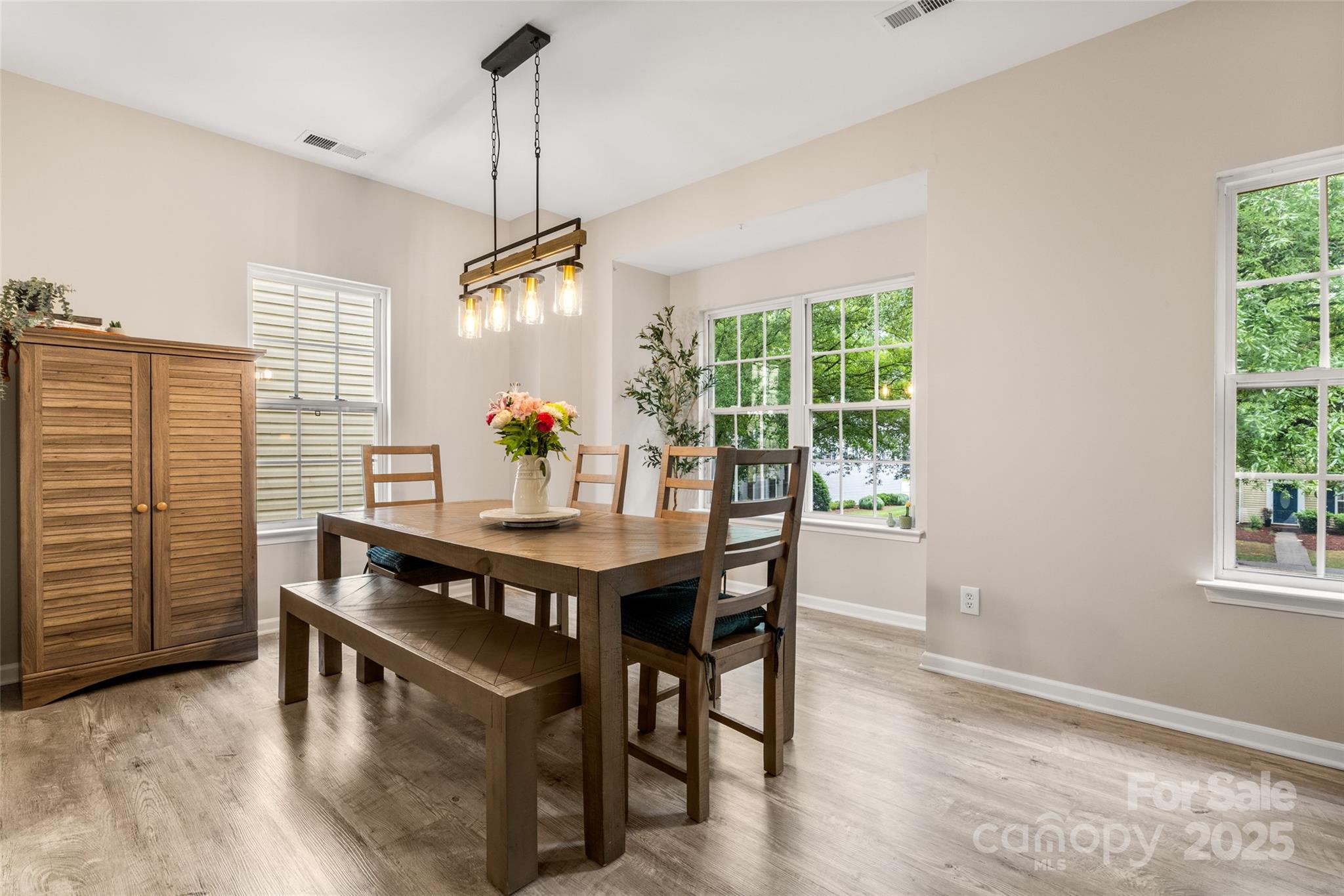 9651 Bailey Road Cornelius, NC 28031 - Photo 12 of 32 a view of a dining room with furniture window and outside view