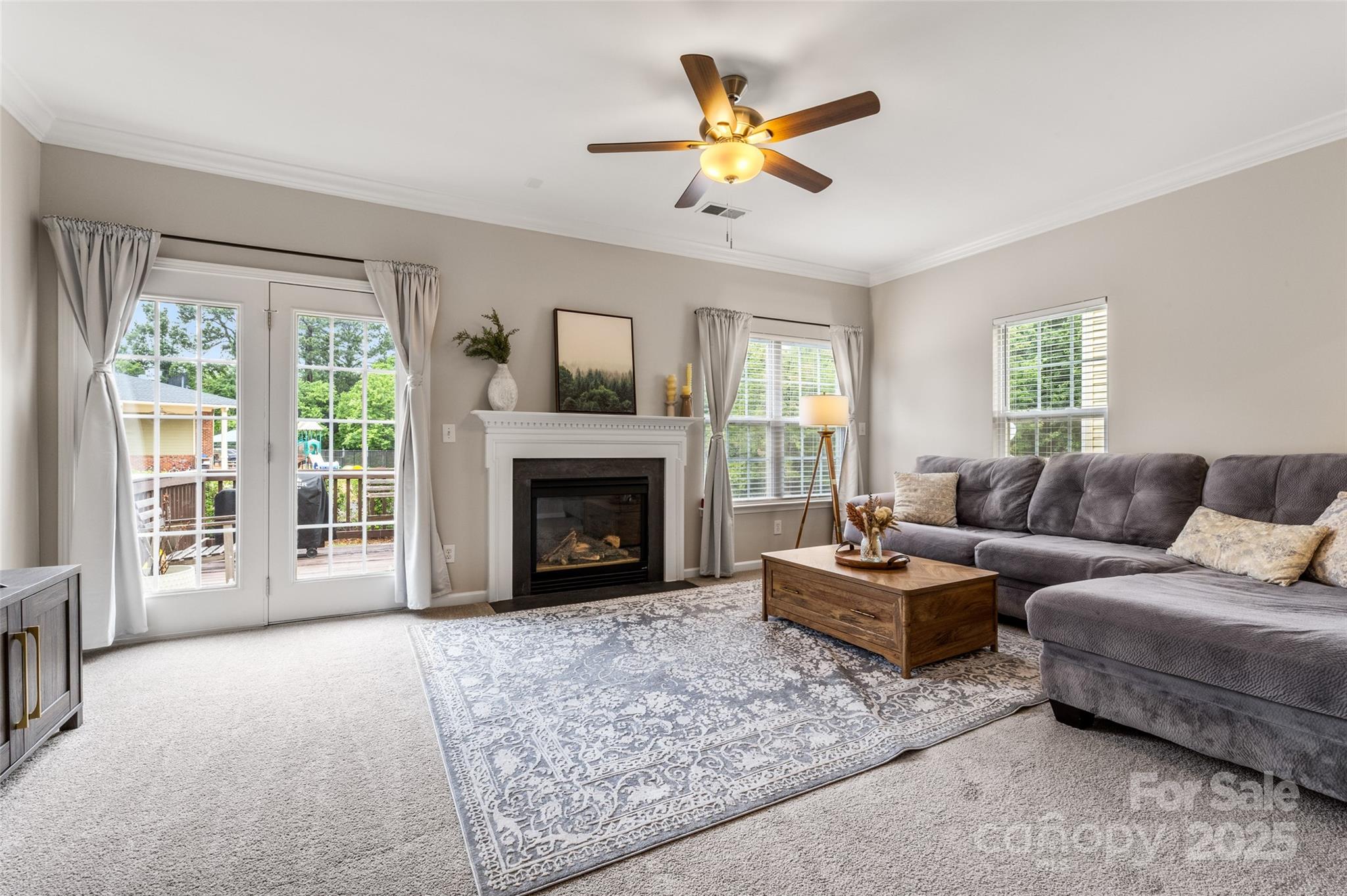 9651 Bailey Road Cornelius, NC 28031 - Photo 14 of 32 a living room with furniture a window and a fireplace