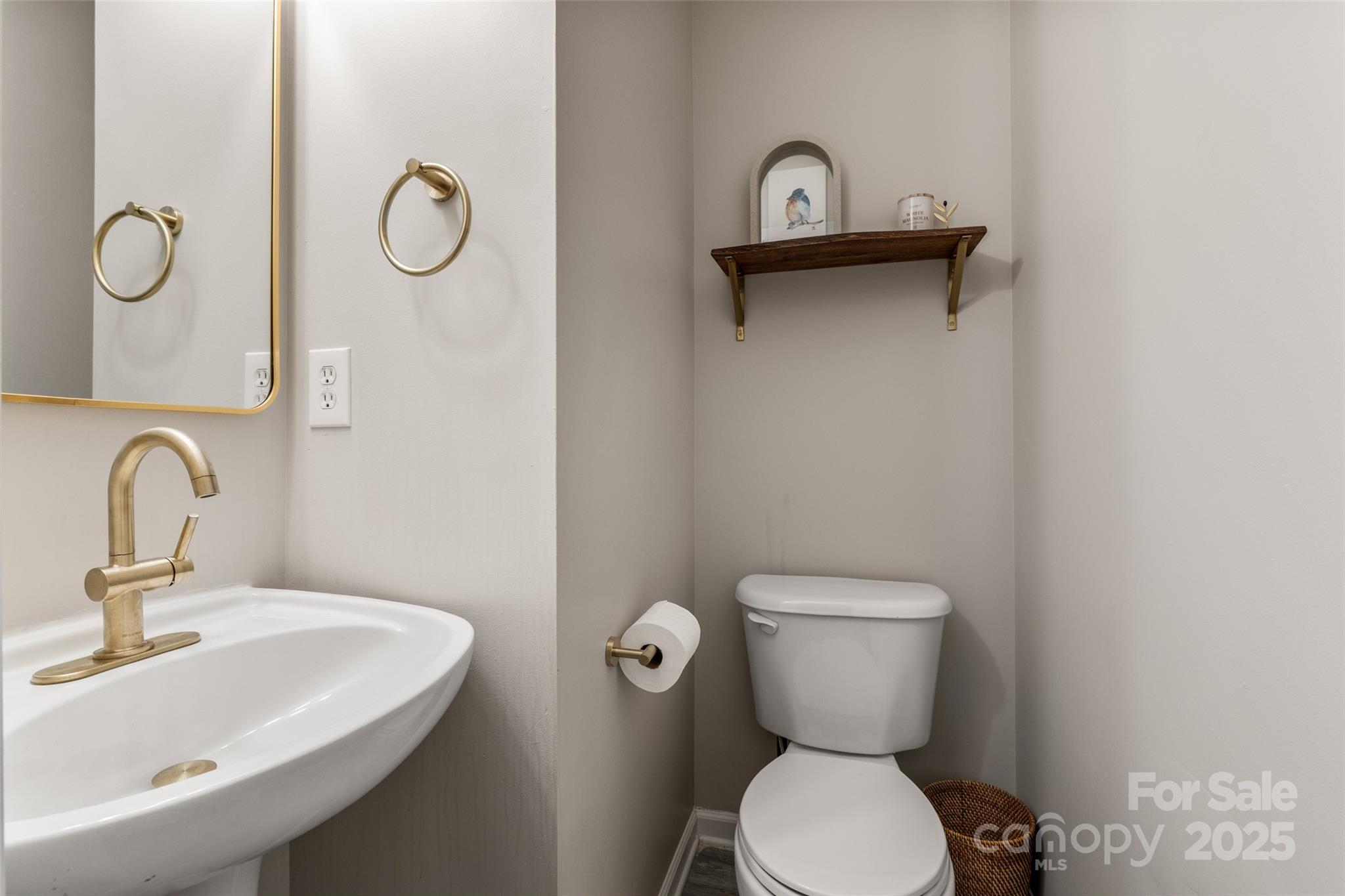 9651 Bailey Road Cornelius, NC 28031 - Photo 17 of 32 a bathroom with a toilet sink and mirror