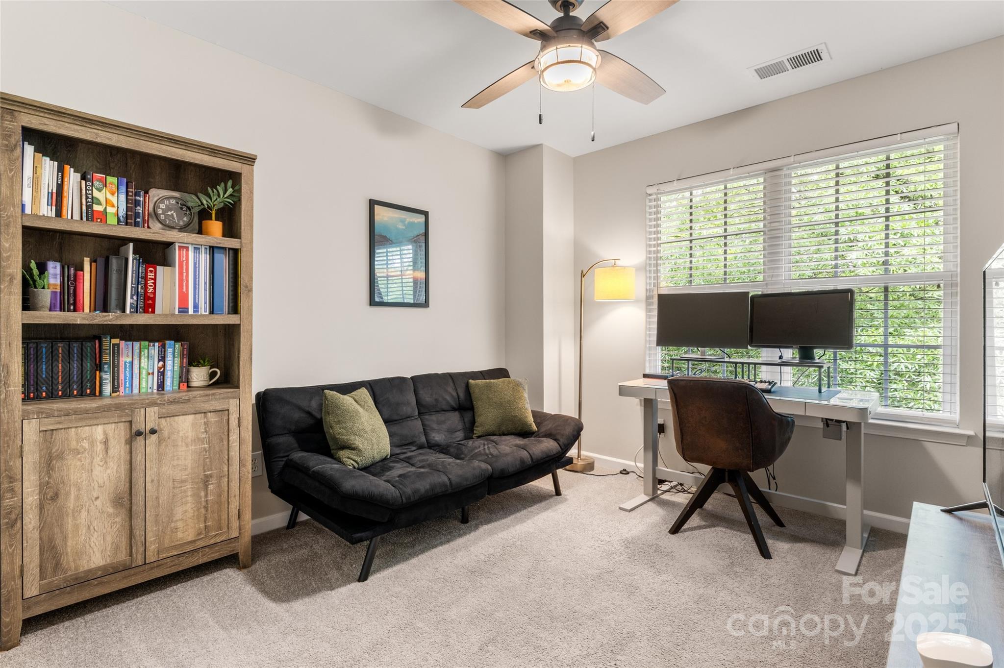 9651 Bailey Road Cornelius, NC 28031 - Photo 23 of 32 a living room with furniture and a flat screen tv