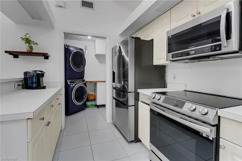 a kitchen with a stove and a microwave
