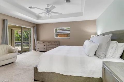 a bedroom with a large bed and a couch