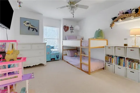 a room with furniture and a flat screen tv