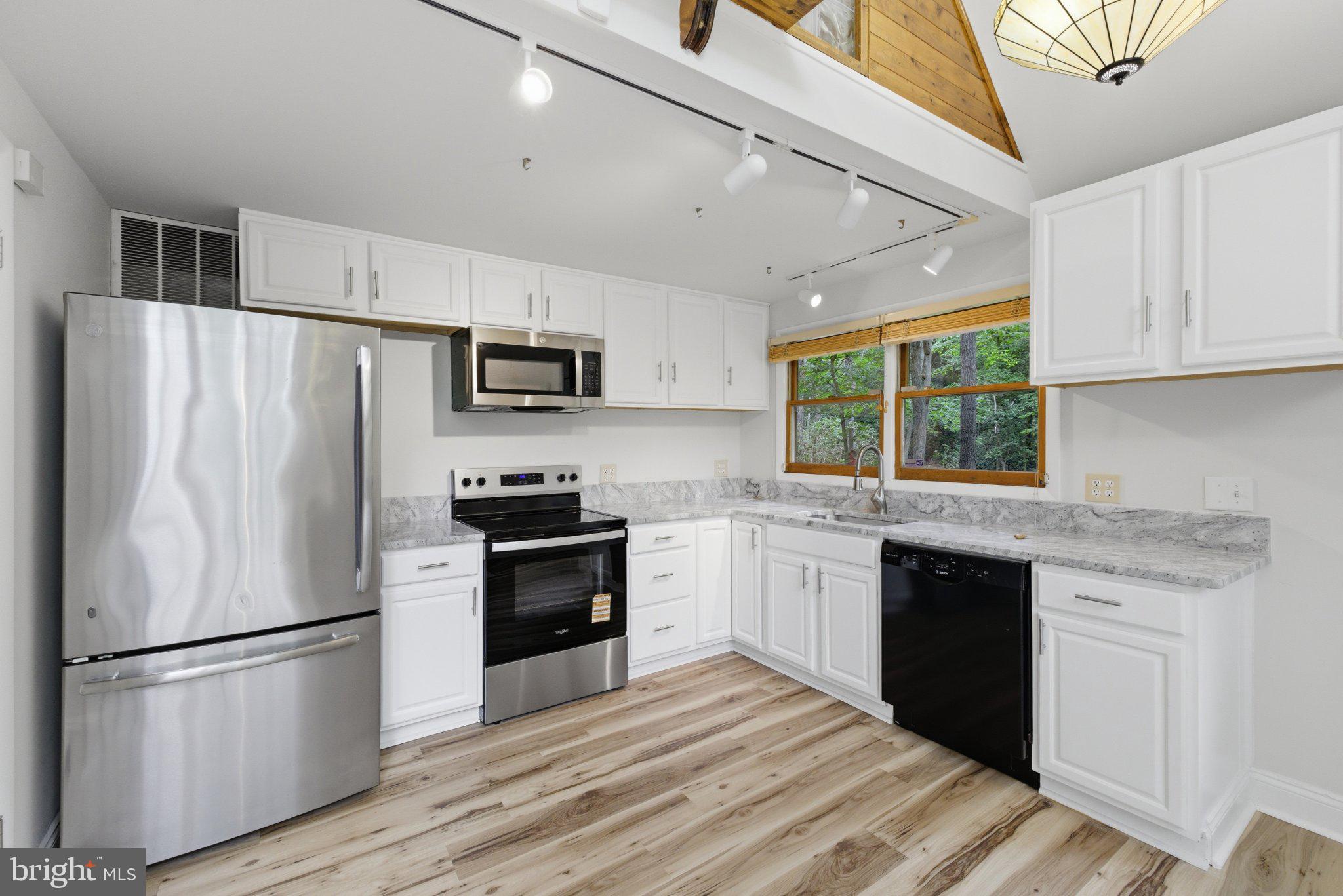 11492 Rawhide Road Lusby, MD 20657 - Photo 6 of 20 Modern kitchen with sleek finishes.