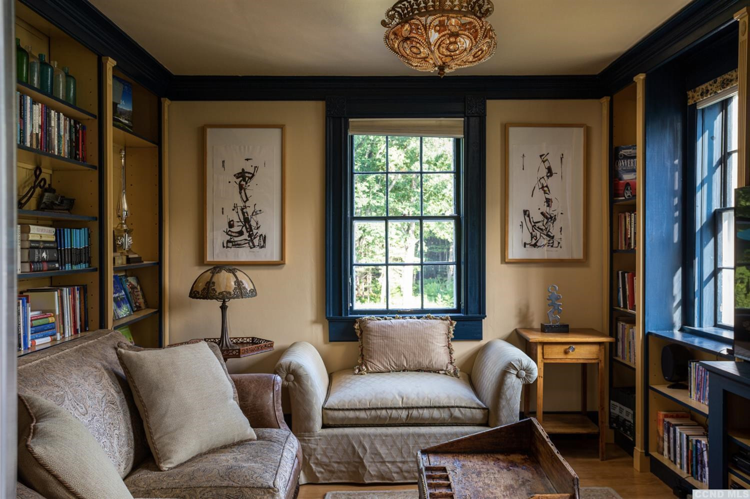 618 A Stonewall Road Austerlitz, NY 12060 - Photo 13 of 37 a living room with furniture a bookshelf and a window