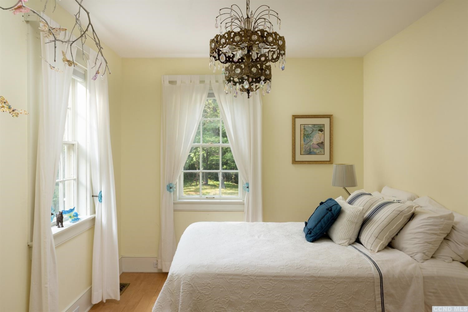 618 A Stonewall Road Austerlitz, NY 12060 - Photo 20 of 37 a bedroom with a bed and a chandelier