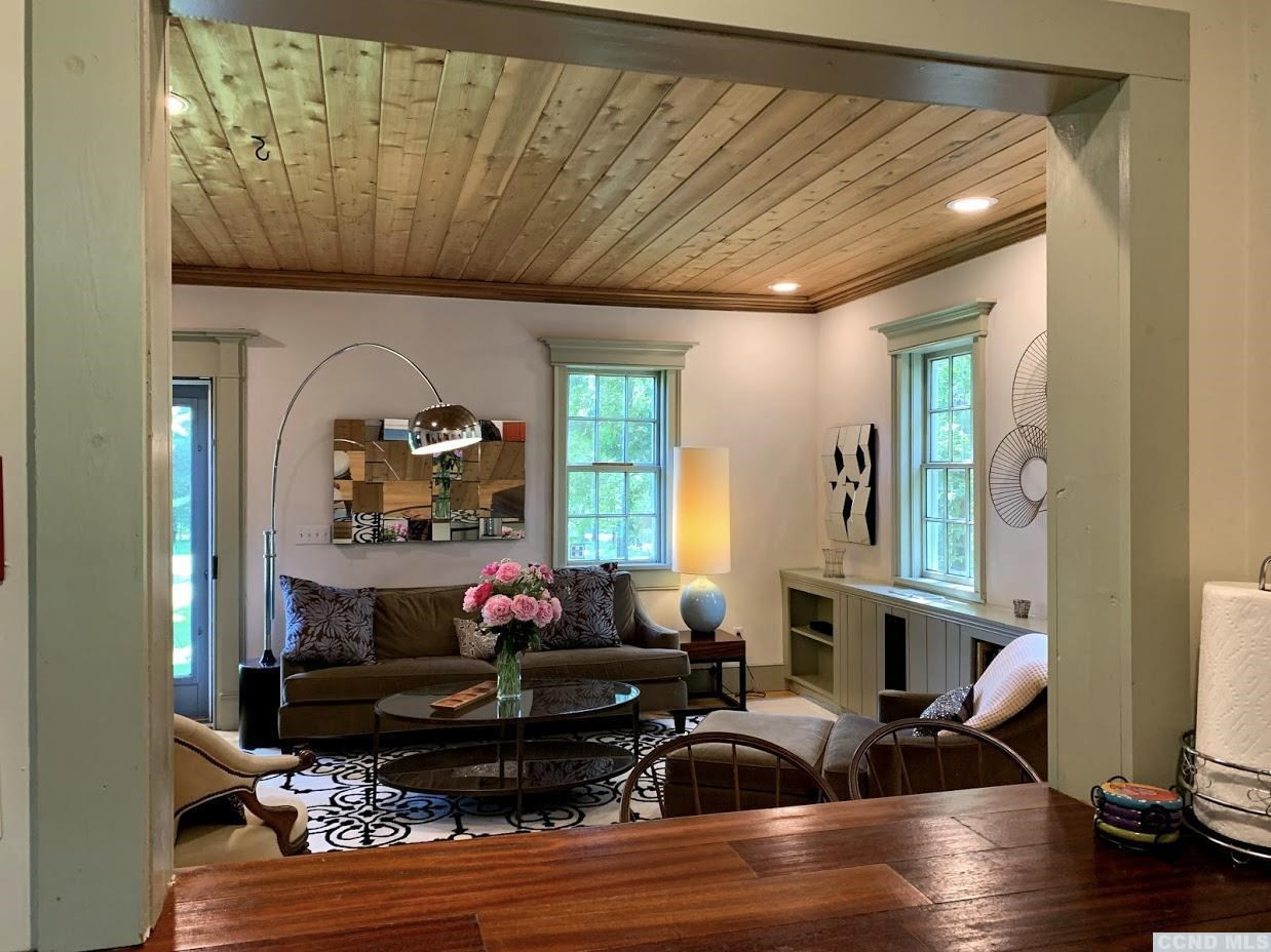 618 A Stonewall Road Austerlitz, NY 12060 - Photo 26 of 37 a living room with furniture and wooden floor