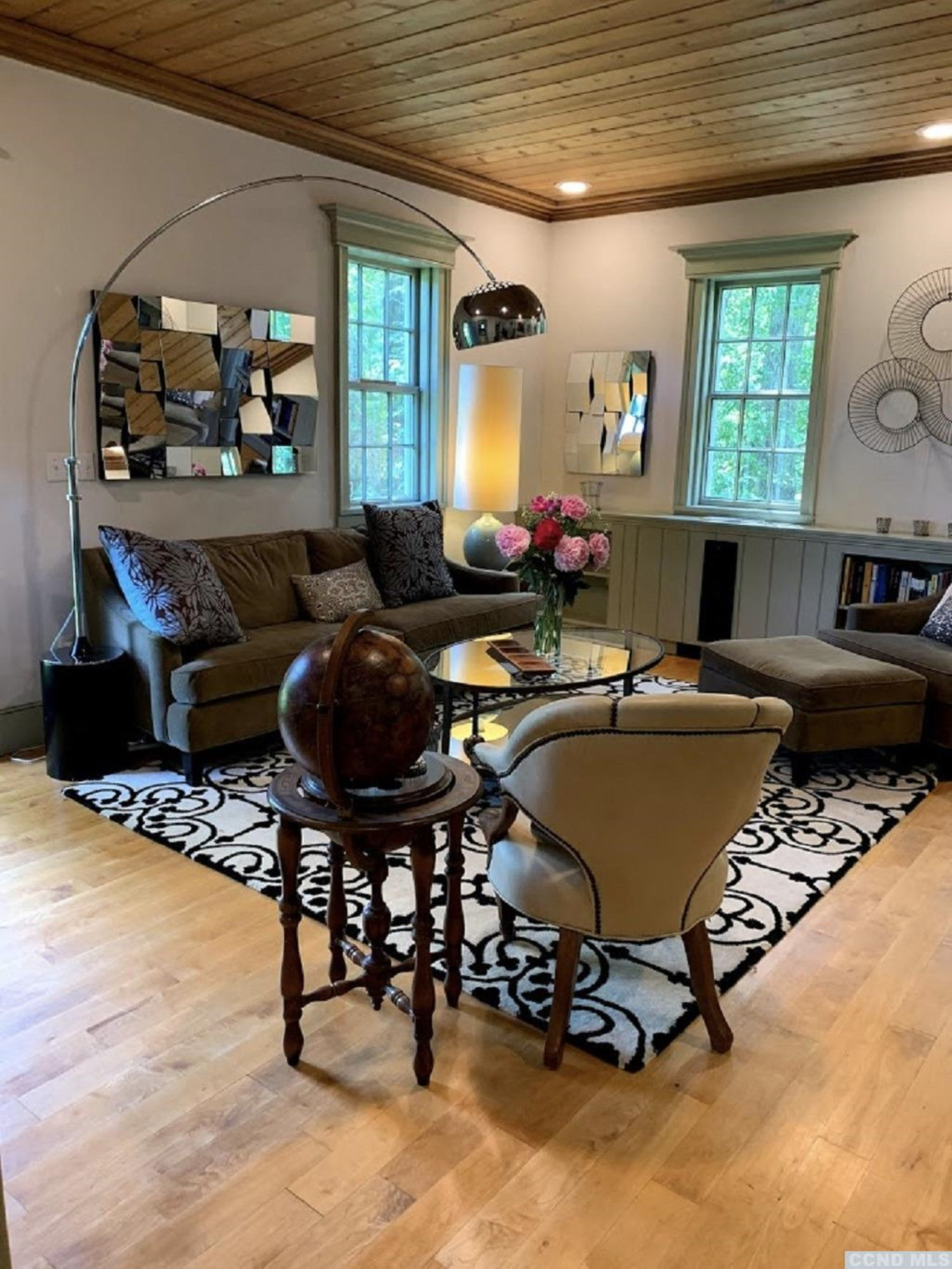 618 A Stonewall Road Austerlitz, NY 12060 - Photo 29 of 37 a living room with furniture gym equipment and a large window