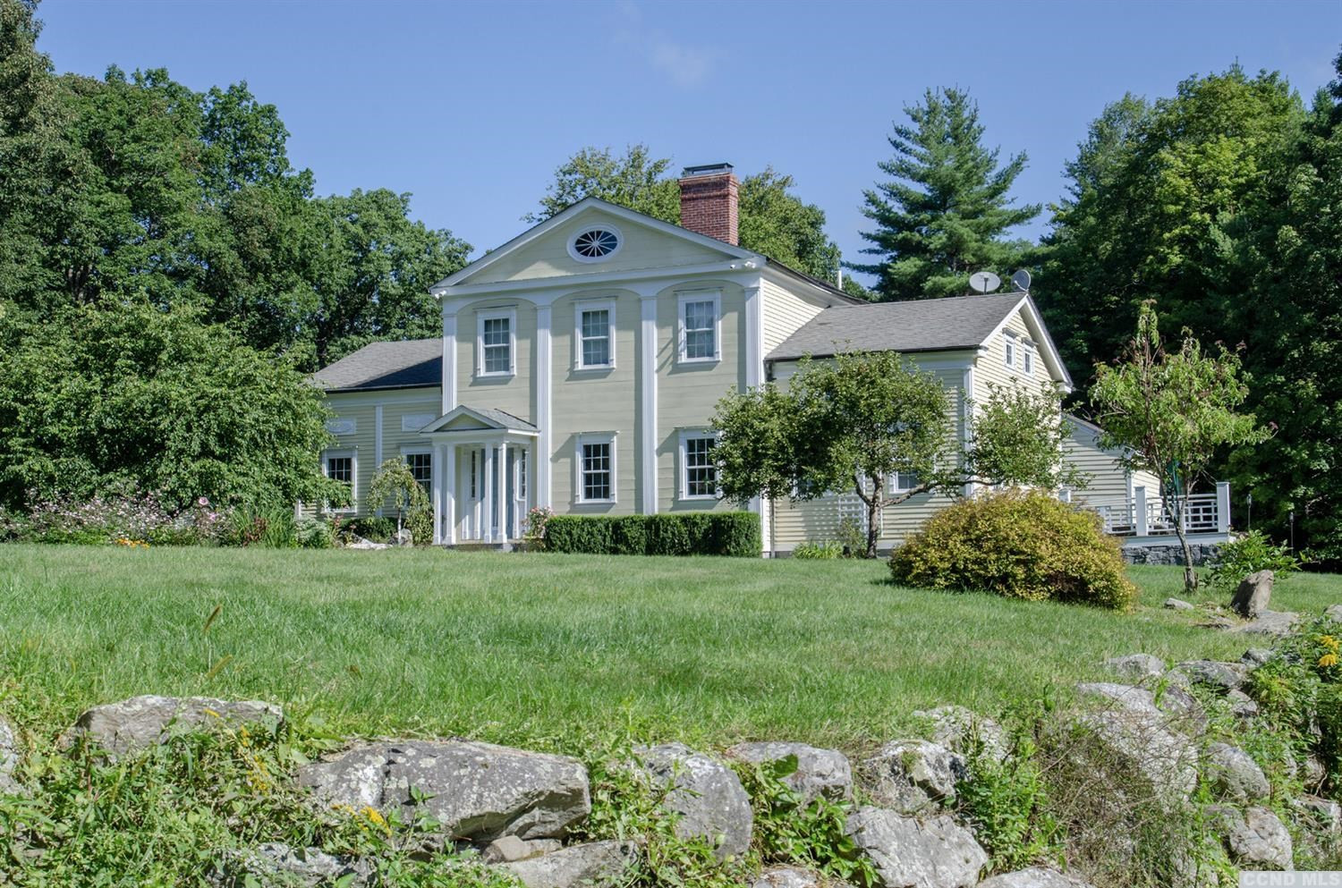 618 A Stonewall Road Austerlitz, NY 12060 - Photo 3 of 37 a front view of a house with a yard