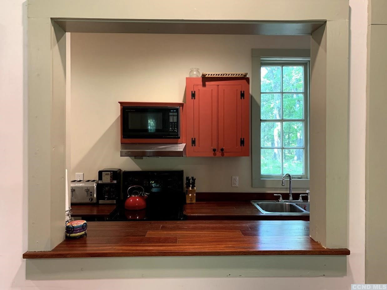 618 A Stonewall Road Austerlitz, NY 12060 - Photo 31 of 37 a living room with furniture and a fireplace