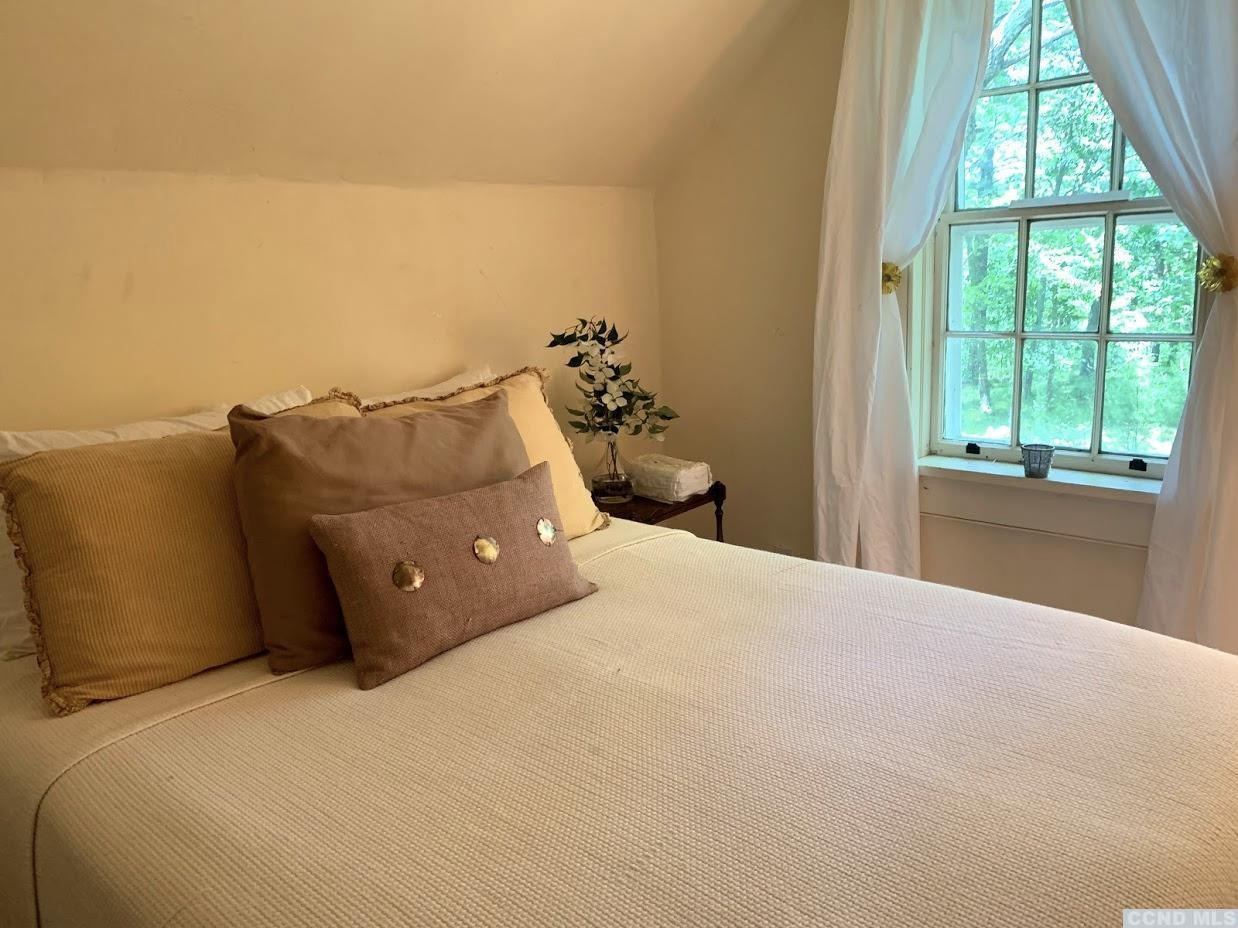 618 A Stonewall Road Austerlitz, NY 12060 - Photo 32 of 37 a bedroom with a bed and a window