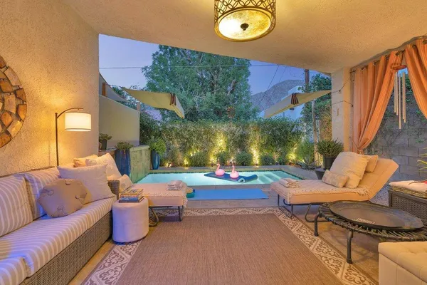 a outdoor living space with furniture and a potted plant