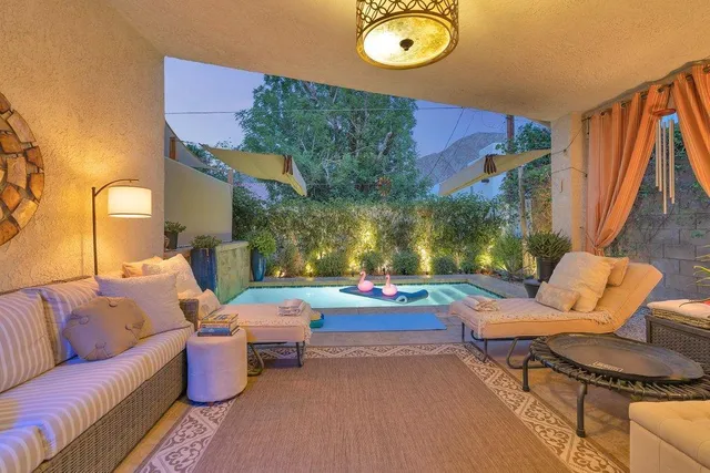a outdoor living space with furniture and a potted plant