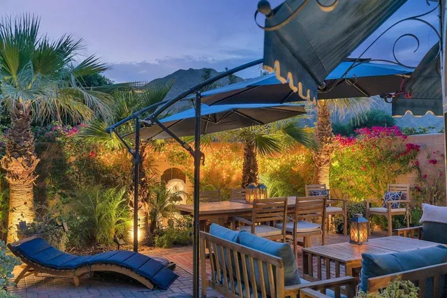 a view of balcony with two chairs and a table