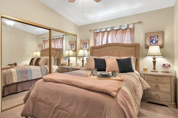 a bed room with bed and a night stand