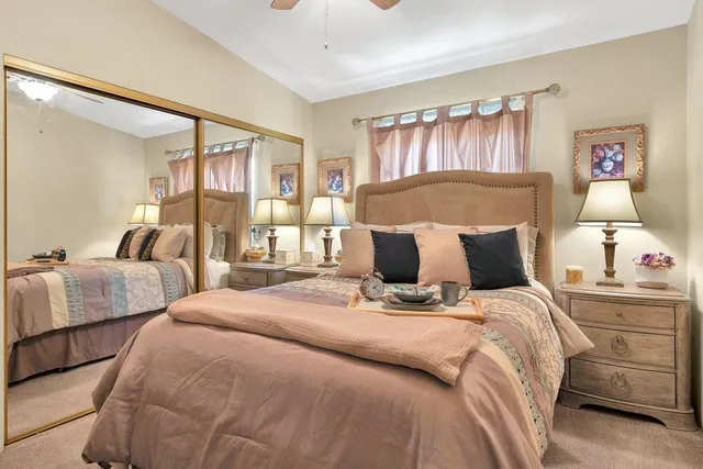 a bed room with bed and a night stand