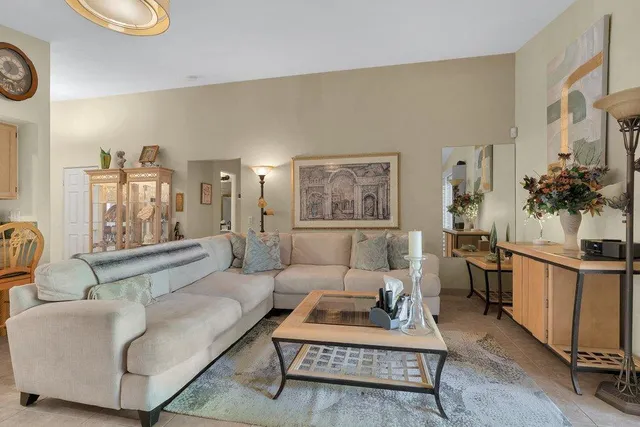 a living room with furniture and a rug