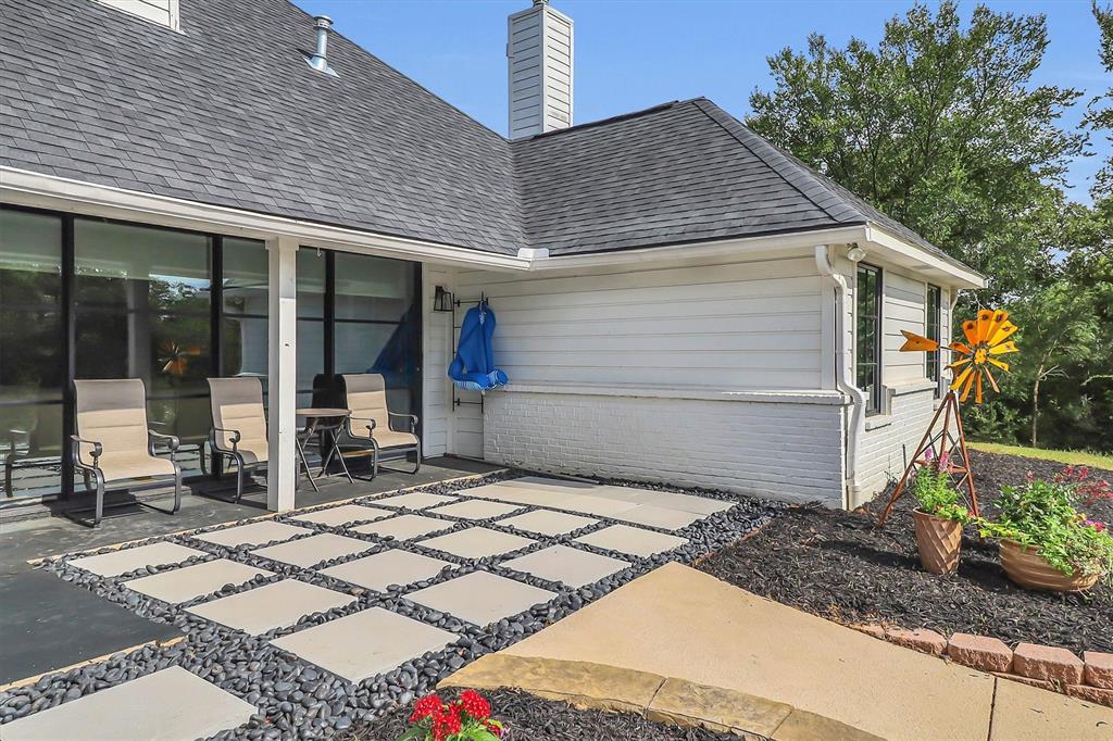 1901 Spring Mountain Road Cross Roads, TX 76227 - Photo 39 of 40 Expansive outdoor patio featuring large square pavers with dark pebble infill