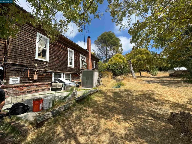 a view of a house with snow on the road
