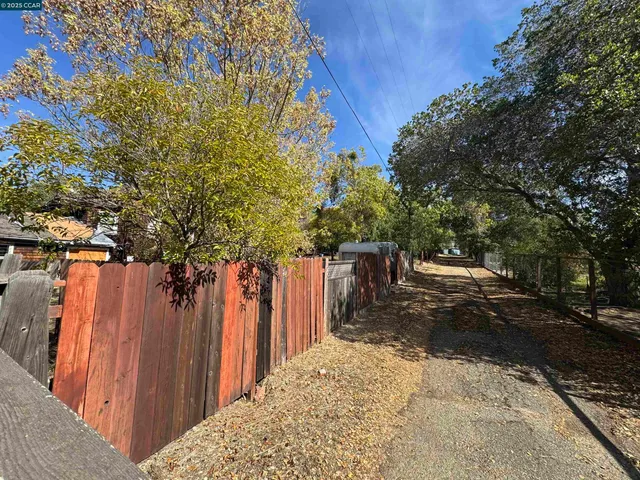 a view of a backyard of the house