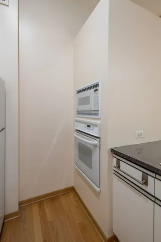 a kitchen with a stove and a microwave