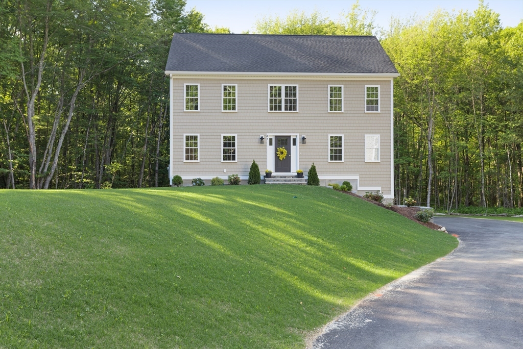 41 Martin Road Douglas, MA 01516 - Photo 3 of 40 a front view of a house with a yard